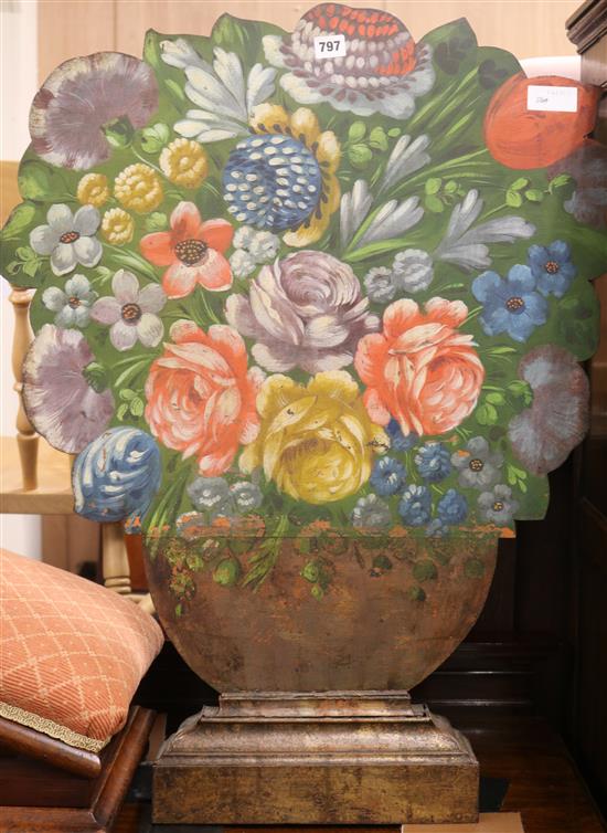 A floral still life painted metal firescreen